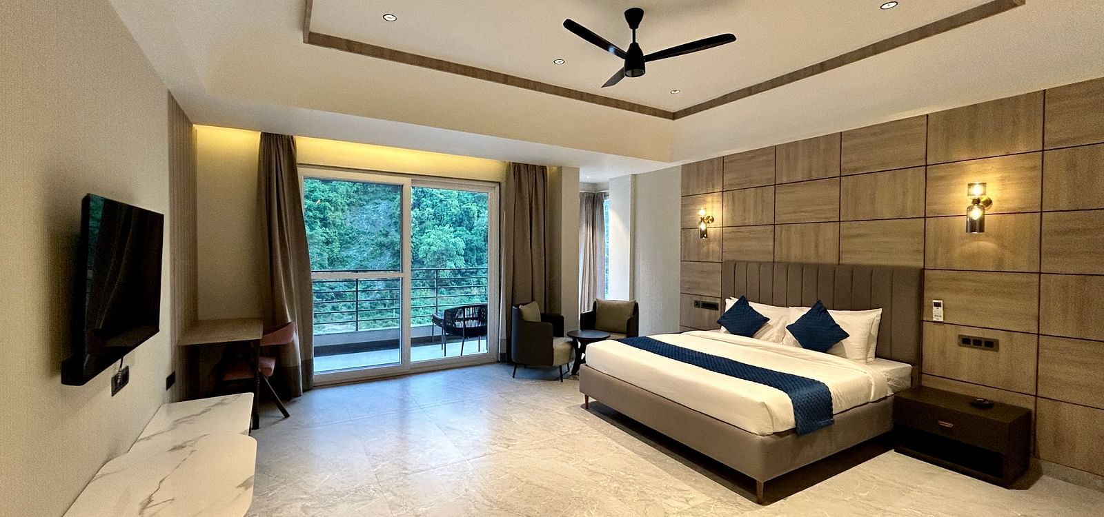 Premium Room at DLS Divine River Resort and Spa featuring a king bed TV and a private balcony with stunning views
